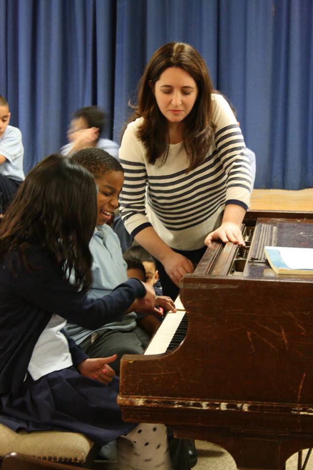 scrunchy face at the piano
