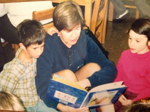 Lea, Zeke and Sarah, reading on the rug